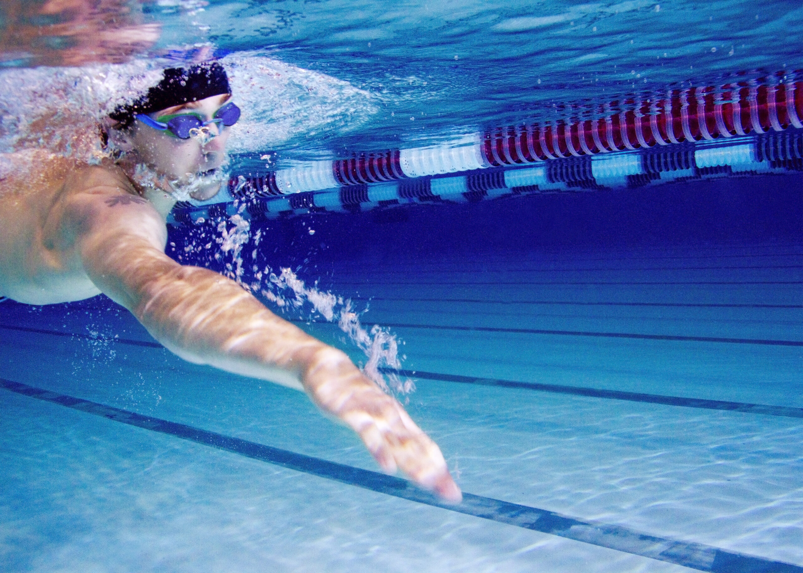 Young Man Swimming In A Swimming Pool
